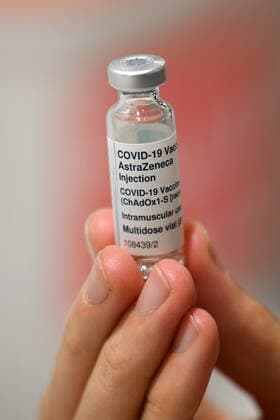 COMMUNITY COVID19 VACCINATION ROLLOUT, A generic image of a AstraZeneca covid19 vaccination vile held by a healthcare worker inside of the Royal Exhibition Centre in Melbourne, Monday, March 22, 2021. More than six million Australians are now eligible to receive coronavirus vaccines under a new phase of the national rollout. Phase 1b of the program kicked off across the country on Monday. ( NO ARCHIVING, EDITORIAL USE ONLY, NO USE IN BOOKS WITHOUT CONSENT MELBOURNE VIC AUSTRALIA  Copyright: xJAMESxROSSx 20210322001529290292