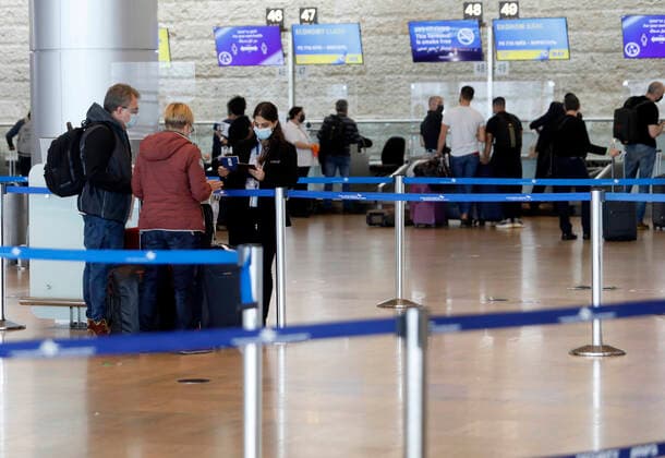 (210321) -- TEL AVIV, March 21, 2021 -- Travelers wait to check in at Ben Gurion International Airport near Tel Aviv, Israel, on March 21, 2021. Israel has lifted a restriction on the number of incoming and outgoing passengers at the airport after the Supreme Court ruled that the two-month-long measure has been unconstitutional. (Photo by Xinhua) ISRAEL-BEN GURION INTERNATIONAL AIRPORT-COVID-19-RESTRICTION-LIFTING GilxCohenxMagen 