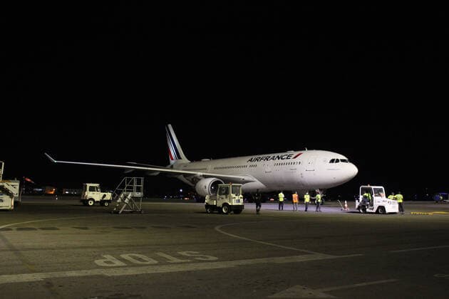 (210322) -- COTONOU, March 22, 2021 -- A plane carrying a batch of coronavirus vaccine developed by the Chinese pharmaceutical company Sinovac arrives at Cardinal Bernadin Gantin International Airport in Cotonou, Benin, March 21, 2021. A batch of coronavirus vaccine developed by the Chinese pharmaceutical company Sinovac arrived in Cotonou, the economic capital of Benin, on Sunday evening. (Photo by Xinhua) BENIN-COTONOU-CHINESE VACCINE-ARRIVAL SeraphinxZounyekpe 