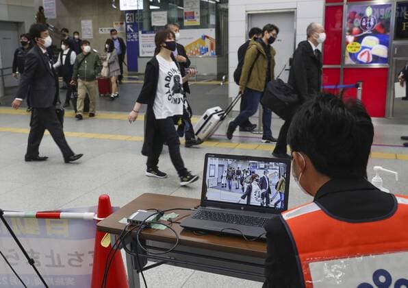 Japan ends COVID-19 state of emergency in Tokyo region Passengers temperatures are monitored near a platform for shinkansen bullet trains arriving from Tokyo at JR Shin-Osaka Station in Osaka on March 22, 2021, after the COVID-19 state of emergency was lifted in the Japanese capital and three neighboring prefectures, the last remaining area of the country that had been under the measure introduced in early January. 