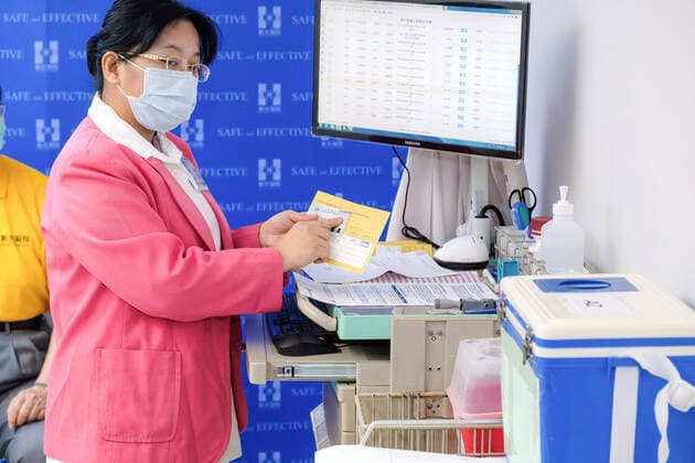 March 22, 2021, Taipei, Taiwan: A medical worker displays the vaccination record for the vaccine against Covid-19 at Taipei City hospital..Medical staff received the first AstraZeneca vaccine against Covid-19 at Taipei City hospital. Taipei Taiwan - ZUMAs197 20210322_zaa_s197_039 Copyright: xWalidxBerrazegx