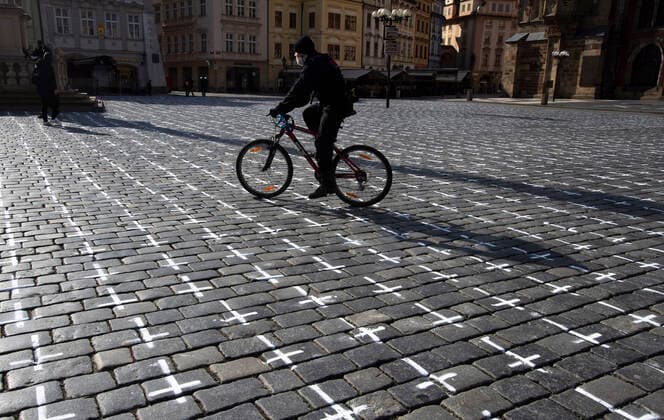 The Million Moments for Democracy civic group honored the memory of those who died with coronavirus by drawing thousands of little crosses at Old Town Square in Prague, Czech Republic, March 22, 2021. The cross should also symbolize the ineffectiveness of the government s COVID combat. (CTKxPhoto KaterinaxSulova) CTKPhotoP202103220333001  suk003