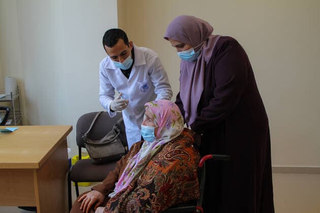 (210322) -- GAZA, March 22, 2021 -- A Palestinian woman receives a dose of COVID-19 vaccine in Gaza City, March 22, 2021. (Photo by Xinhua) MIDEAST-GAZA CITY-COVID-19-VACCINATION RizekxAbdeljawad 