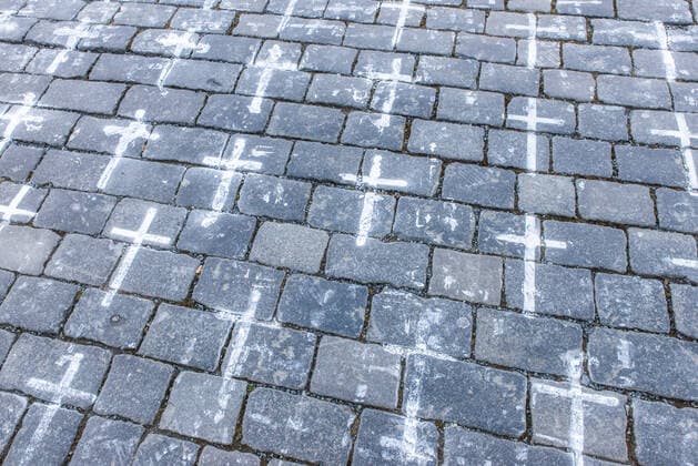 The Million Moments for Democracy civic group honored the memory of those who died with coronavirus by drawing thousands of little crosses at Old Town Square in Prague, Czech Republic, March 22, 2021. The cross should also symbolize the ineffectiveness of the government s COVID combat. (CTKxPhoto JanaxPlavec) CTKPhotoF202103221072501 