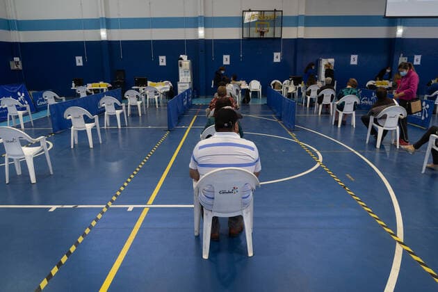 March 22, 2021, Santiago, Metropolitana, Chile: A man waits in line to receive the dose of the Sinovac or Pfizer vaccine, in a municipal stadium transformed into a vaccination center against covid in Santiago, Chile. Santiago Chile - ZUMAb332 20210322_zip_b332_013 Copyright: xMatiasxBasualdox