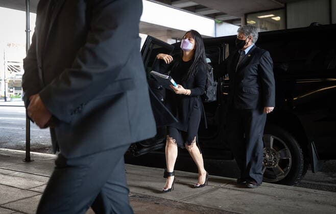 March 22, 2021, Vancouver, BC, Canada: Meng Wanzhou, chief financial officer of Huawei, carries a binder of documents as she arrives at B.C. Supreme Court, in Vancouver, on Monday, March 22, 2021. Vancouver Canada - ZUMAc35_ 20210322_zaf_c35_016 Copyright: xDarrylxDyckx