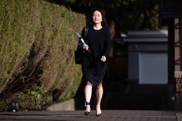 March 22, 2021, Vancouver, BC, Canada: Meng Wanzhou, chief financial officer of Huawei, carries a binder of documents as she leaves her home to attend a hearing at B.C. Supreme Court, in Vancouver, on Monday, March 22, 2021. Vancouver Canada - ZUMAc35_ 20210322_zaf_c35_021 Copyright: xDarrylxDyckx