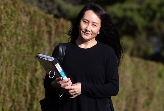 March 22, 2021, Vancouver, BC, Canada: Meng Wanzhou, chief financial officer of Huawei, carries a binder of documents as she leaves her home to attend a hearing at B.C. Supreme Court, in Vancouver, on Monday, March 22, 2021. Vancouver Canada - ZUMAc35_ 20210322_zaf_c35_023 Copyright: xDarrylxDyckx