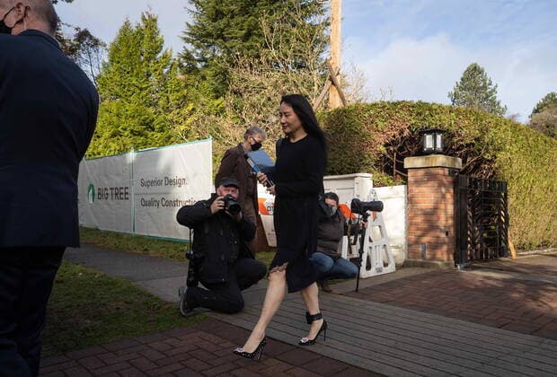 March 22, 2021, Vancouver, BC, Canada: Meng Wanzhou, chief financial officer of Huawei, carries a binder of documents as she leaves her home to attend a hearing at B.C. Supreme Court, in Vancouver, on Monday, March 22, 2021. Vancouver Canada - ZUMAc35_ 20210322_zaf_c35_027 Copyright: xDarrylxDyckx