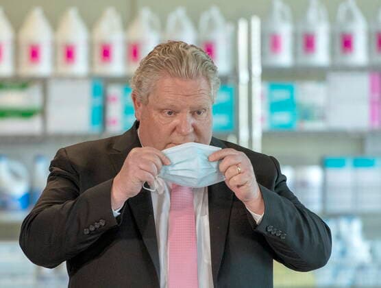 March 22, 2021, Toronto, on, Canada: Ontario Premier Doug Ford puts his mask back on after speaking in his daily briefing at Rouge Valley Hospital in Toronto on Monday, March 22, 2021. Toronto Canada  - ZUMAc35_ 20210322_zaf_c35_035 Copyright: xFrankxGunnx