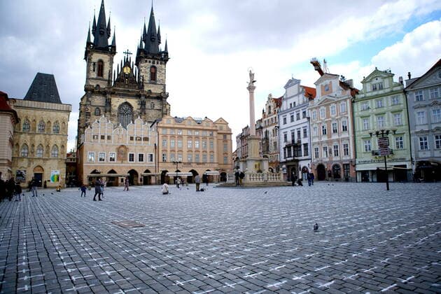 (210323) -- PRAGUE, March 23, 2021 -- The ground of the Old Town Square is seen painted with thousands of white crosses in memory of the victims of the COVID-19 pandemic in Prague, Czech Republic, on March 22, 2021. (Photo by Xinhua) CZECH REPUBLIC-PRAGUE-COVID-19-VICTIMS-MEMORIAL DanaxKesnerova 