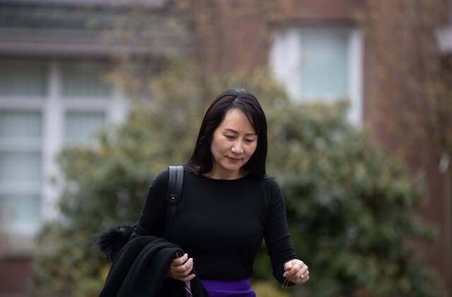 March 23, 2021, Vancouver, BC, Canada: Meng Wanzhou, chief financial officer of Huawei, leaves her home to attend a hearing at B.C. Supreme Court in Vancouver on Tuesday, March 23, 2021. Vancouver Canada  - ZUMAc35_ 20210323_zaf_c35_023 Copyright: xDarrylxDyckx