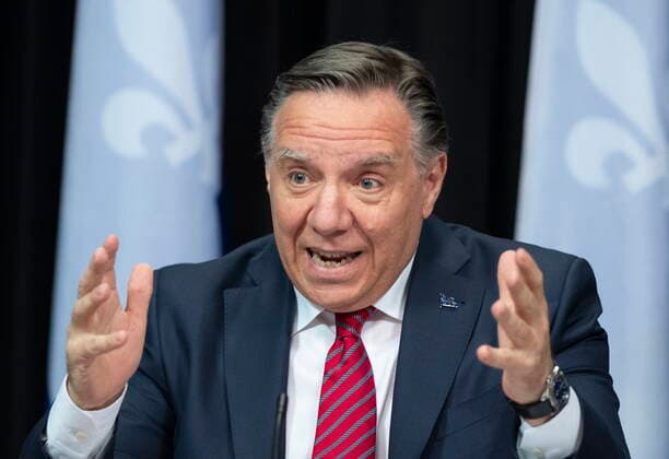 March 23, 2021, QUEBEC, PQ, Canada: Quebec Premier Francois Legault, centre responds to reporters questions during a news conference on the COVID-19 pandemic, Tuesday, March 23, 2021 at the legislature in Quebec City. QUEBEC Canada  - ZUMAc35_ 20210323_zaf_c35_026 Copyright: xJacquesxBoissinotx