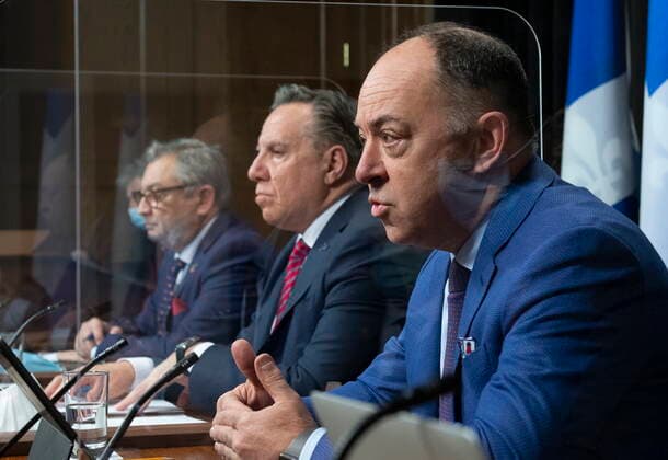 March 23, 2021, QUEBEC, PQ, Canada: Quebec Health Minister Christian Dube, right, responds to reporters questions during a news conference on the COVID-19 pandemic, Tuesday, March 23, 2021 at the legislature in Quebec City. Quebec Premier Francois Legault, centre, and Horacio Arruda, Quebec director of National Public Health, look on QUEBEC Canada - ZUMAc35_ 20210323_zaf_c35_030 Copyright: xJacquesxBoissinotx