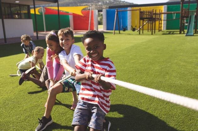 Group of school kids playing tug of war Front view of multi ethnic group of happy school kids playing tug of war in playground, model released, , property released, Cork, Ireland, 05.02.2019, 1238695.jpg, school, playground, casual clothing, school kid, schoolboy, schoolgirl, student, classmate, playing, joy, joyful, game, tug of war, enjoying, happy, smiling, standing, holding, stretching, childhood, innocence, development, education, academic, information, knowledge, lifestyle, elementary, intelligent, intelligence, wisdom, break, running, active, break time, recess, fun, enjoy, together, group, friend, diversity, sunny, summer Outdoors,Day