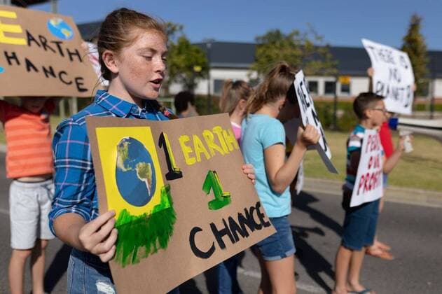 Group of elementary school pupils walking on a protest march Side view of a group of Caucasian elementary school pupils on a protest march, carrying signs with environmental and conservation slogans on them, walking down a road in the sun, model released, , property released, Cape Town, South Africa, 01.12.2019, 1303607.jpg, people,real people,classmates,school,elementary school,primary school,protest,demonstration,communication,together,interacting,community,society,environmental issues,eco,green,sign,banner,education,student,pupil,information,environment,global warming,climate change,youth,future,concern,global,earth,activism,pollution,ecology,change,conservation,values,holding,marching,walking,slogan,message,politics,attitude,childhood,