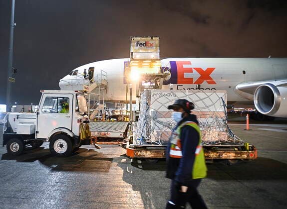 March 24, 2021, Toronto, on, Canada: FedEx workers offload a plane carrying 255,600 doses of the Moderna COVID-19 vaccine which came from Europe during the COVID-19 pandemic at Pearson International Airport in Toronto on Wednesday, March 24, 2021. Toronto Canada  - ZUMAc35_ 20210324_zaf_c35_013 Copyright: xNathanxDenettex