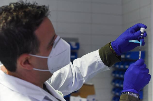 March 24, 2021, Coria, Caceres, Spain: Coria City Hospital nurse, Raul Martin, gets the syringes with the dose ready during the first day of the Astra Zeneca vaccine administration. Coria Spain - ZUMAs197 20210324_zaa_s197_081 Copyright: xGustavoxValientex