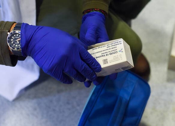 March 24, 2021, Coria, Caceres, Spain: A Coria City Hospital nurse holds a box with empty Astra Zeneca vaccine ampoules, during the first day of the Astra Zeneca vaccine administration. Coria Spain - ZUMAs197 20210324_zaa_s197_085 Copyright: xGustavoxValientex