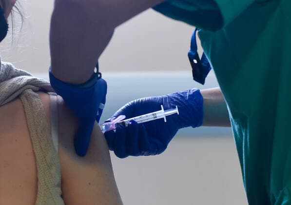 March 24, 2021, Coria, Caceres, Spain: A Coria City Hospital nurse injects the vaccine to a key worker, during the first day of the Astra Zeneca vaccine administration. Coria Spain - ZUMAs197 20210324_zaa_s197_092 Copyright: xGustavoxValientex