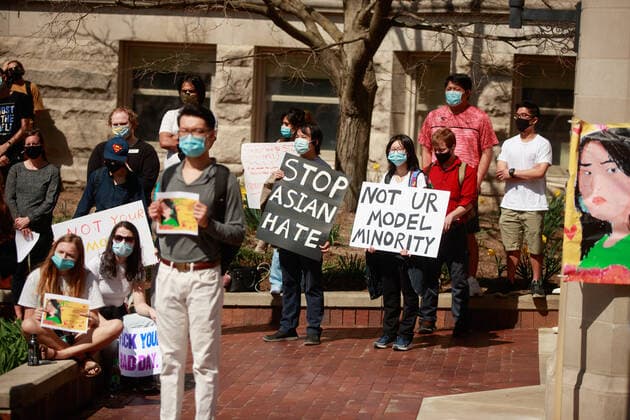 March 24, 2021, Bloomington, Indiana, United States: Protesters hold placards expressing their opinions during the demonstration..Indiana University students protested against Asian Hate in the United States today because of the killing of Asians last week in Atlanta, Georgia. There have been a lot of bias incidents as well because of Donald Trump s racist comments blaming China for the Coronavirus. Bloomington United States - ZUMAs197 20210324_zaa_s197_237 Copyright: xJeremyxHoganx
