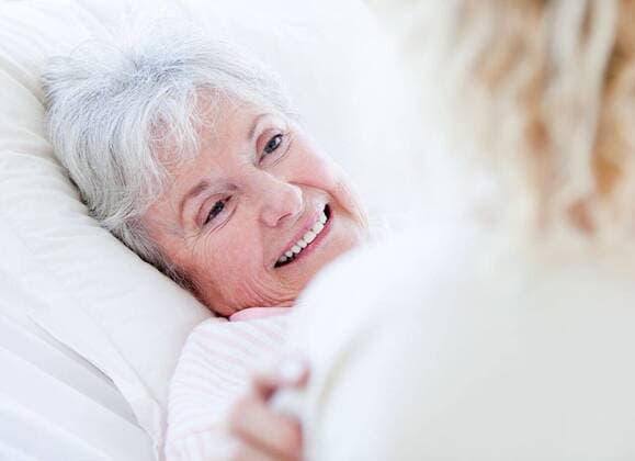 Cheerful senior woman lying on a hospital bed talking with her granddaughter Cheerful senior woman lying on a hospital bed talking with her granddaughter. Medical concept., model released, Cape Town, South Africa, 2009-09-30T23:00:00.000Z, 25881.jpg, charming, bed, lying, lying down, examination, medical, checkup, exam, observation, physical, probe, test, health, practitioner, patient, physician, examining, healthcare, doctor, equipment, health care, maintenance, diagnosis, consulting, happy, smiling, smile, adult, discuss, discussing, talk, talking, interacting, interaction, healthcare, hospital, clinic, clinical, sick, ill, physical injury, grandmother, granddaughter Child, Girl, Female, Caucasian, 70s, Mature Adult, Woman, Caucasian Ap