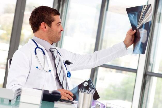 Doctor examining a xray Doctor examining a xray in the office, model released, Cape Town, South Africa, 2009-03-29T23:00:00.000Z, 32284.jpg, analysis, backbone, care, clinic, diagnostic, doctor, examine, group, health, health care, hospital, job, laboratory, looking, medical, medicine, nurse, office, pediatricianal, photo, physician, portrait, practitioner, radiologist, radiology, research, scan, specialist, stethoscope, surgeon, uniform, white, work, workplace, x ray 20s, Young Adult, Man, Male, Caucasian, Caucasian Appearance, 25-29 Years, Young Men
