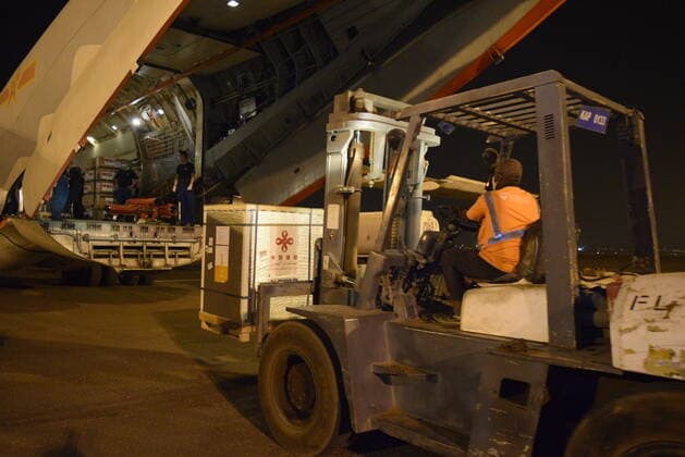 (210327) -- KHARTOUM, March 27, 2021 -- Chinese vaccines are unloaded from a plane at the Khartoum International Airport in Khartoum, Sudan, March 26, 2021. A batch of China s Sinopharm COVID-19 vaccines, donated by the Chinese government to Sudan, arrived here on Friday. ) SUDAN-KHARTOUM-CHINESE VACCINE-ARRIVAL MaxYichong 