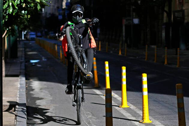 Santiago 27 March 2021 Delivery workers carry out their deliveries in the Commune of Santiago during Total Quarantine for Covid pandemic 19 Javier Salvo Aton Chile, Santiago Chile Aton Chile Aton 497680  Copyright: JAVIERxSALVO ATONxCHILE