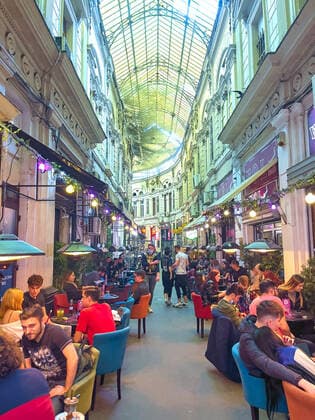 Old town with restaurants and bars with tourists and local people in Bucharest, Romania on March 27, 2021.