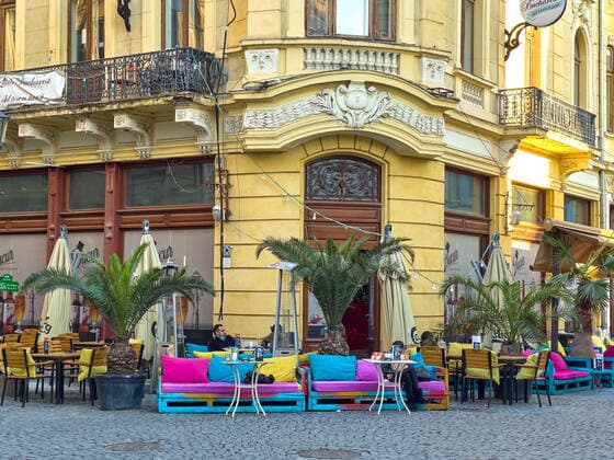 Old town with restaurants and bars with tourists and local people in Bucharest, Romania on March 27, 2021.