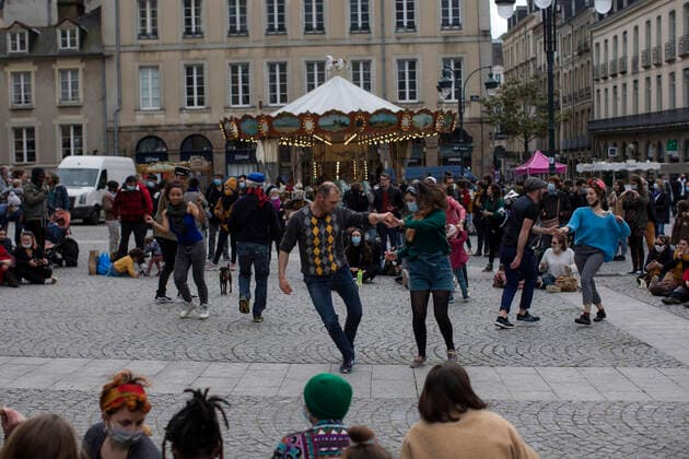 People dance in a gathering in front of the Opera in Rennes, western France. March 27, 2021  Copyright: xJeremiasxGonzalezx