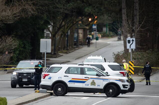 March 27, 2021, North Vancouver, BC, Canada: An RCMP officer takes photographs where a person was taken into custody not far from the Lynn Valley Library, in North Vancouver, B.C., Saturday, March 27, 2021. Police say multiple victims were stabbed inside and outside the library today. North Vancouver Canada  - ZUMAc35_ 20210327_zaf_c35_037 Copyright: xDarrylxDyckx