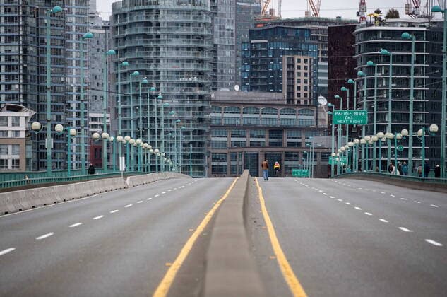 March 27, 2021, Vancouver, BC, Canada: A person walks on the empty Cambie Bridge which was closed to vehicles after people taking part in an Extinction Rebellion protest against old-growth logging marched onto the bridge and occupied it, in Vancouver, B.C., Saturday, March 27, 2021. Vancouver Canada  - ZUMAc35_ 20210327_zaf_c35_054 Copyright: xDarrylxDyckx