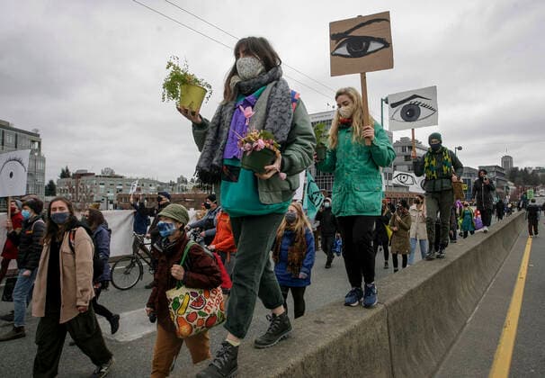 (210327) -- VANCOUVER, March 27, 2021 -- People march during a climate change protest in Vancouver, British Columbia, Canada, on March 27, 2021. (Photo by Xinhua) CANADA-VANCOUVER-CLIMATE CHANGE-PROTEST LiangxSen 