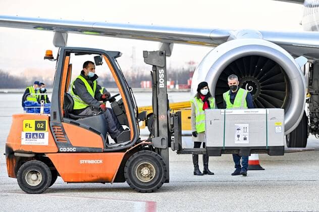 (210328) -- SKOPJE, March 28, 2021 -- Workers load North Macedonia s first batch of AstraZeneca s COVID-19 vaccines received through the UN-backed Covax program, at Skopje s International Airport in Skopje, North Macedonia, March 28, 2021. (Photo by Xinhua) NORTH MACEDONIA-SKOPJE-COVID-19-VACCINE TomislavxGeorgiev 