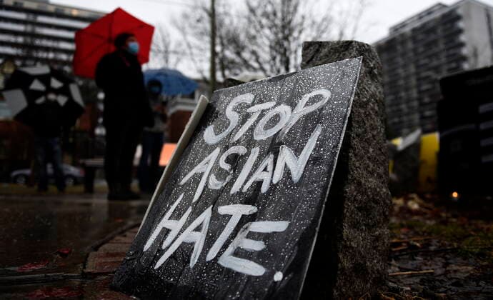 March 28, 2021, Ottawa, on, Canada: Rain beads on a sign as community members gather at the Ottawa Women s Monument in Minto Park for a vigil in memory of the victims of the Atlanta spa shootings and to rally against anti-Asian racism, in Ottawa, on Sunday, March 28, 2021. Ottawa Canada  - ZUMAc35_ 20210328_zaf_c35_073 Copyright: xJustinxTangx