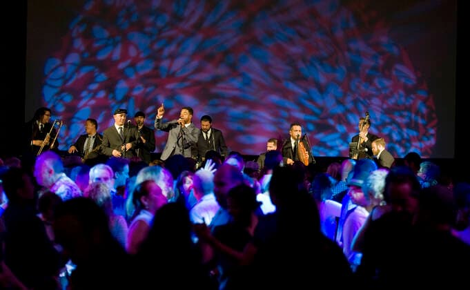 March 28, 2021, Costa Mesa, California, USA: Boogaloo Assassins perform in the plaza at the Segerstrom Center for the Arts. The Boogaloo Assassins is a12 piece Boogaloo, Salsa and Latin Soul group from Los Angeles, California. Costa Mesa USA - ZUMAk145 20210328_zap_k145_095 Copyright: xNicholasxKoonx