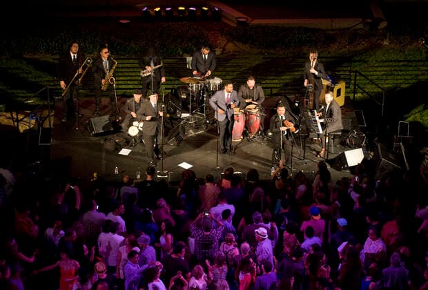March 28, 2021, Costa Mesa, California, USA: Boogaloo Assassins perform in the plaza at the Segerstrom Center for the Arts. The Boogaloo Assassins is a12 piece Boogaloo, Salsa and Latin Soul group from Los Angeles, California. Costa Mesa USA - ZUMAk145 20210328_zap_k145_114 Copyright: xNicholasxKoonx