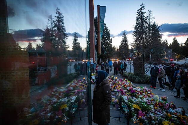 March 28, 2021, Vancouver, BC, Canada: People pause at a memorial outside the Lynn Valley Library for the victims of a mass stabbing incident that happened Saturday inside and around the library, in North Vancouver, B.C., on Sunday, March 28, 2021. A 28-year-old man was charged Sunday with second-degree murder in a stabbing rampage that left a young woman dead and injured six others around a library in North Vancouver on Saturday. Vancouver Canada  - ZUMAc35_ 20210328_zaf_c35_159 Copyright: xDarrylxDyckx