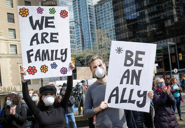 (210328) -- VANCOUVER, March 28, 2021 -- People hold placards during a Stop Asian Hate rally in Vancouver, British Columbia, Canada, on March 28, 2021. Hundreds of people took part in the rally against the racism toward Asians here on Sunday. (Photo by Xinhua) CANADA-VANCOUVER-RALLY-STOP ASIAN HATE LiangxSen 