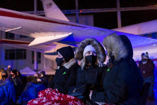 March 28, 2021, Tukwila, Washington, USA: Attendees, bundled against cold weather, watch Payge Turner perform at the Museum of FlightÃ¢â‚¬â ¢s Aviation Pavilion in Seattle on Sunday, March 28, 2021. The cityÃ¢â‚¬â ¢s first socially distanced concert event was held with elevated hygiene protocols including mandatory masking, strict social distancing between pods of up to four people and a maximum attendance of 150 people. Tukwila USA - ZUMAg235 20210328_zap_g235_012 Copyright: xPaulxChristianxGordonx