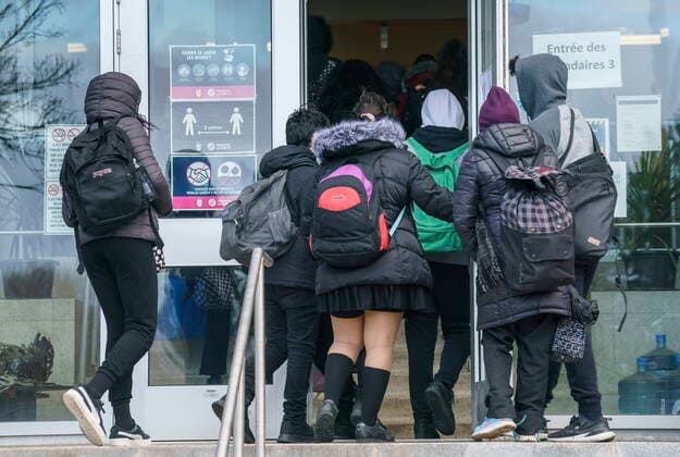 March 29, 2021, Montreal, PQ, Canada: Students enter the Pierre Laporte Secondary School as secondary school students return to class full time during the COVID-19 pandemic in Montreal, on Monday, March 29, 2021. Montreal Canada  - ZUMAc35_ 20210329_zaf_c35_006 Copyright: xPaulxChiassonx