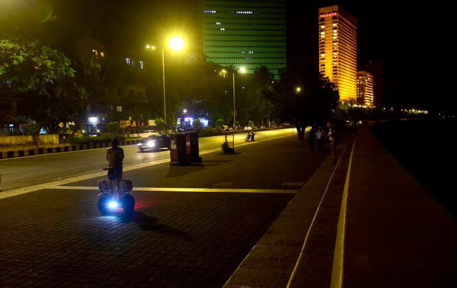 MUMBAI, INDIA - MARCH 28: Police on Segway patrolling Marine Drive after a night curfew between 8:00 pm to 7:00 am came into effect, on March 28, 2021 in Mumbai, India. (Photo by Anshuman Poyrekar Hindustan Times) Covid 19 Night Curfew In Mumbai Tourists Spot Wear Deserted Look
