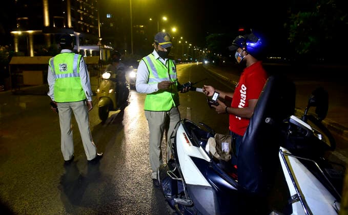 MUMBAI, INDIA - MARCH 28: Police checking commuters at a checkpost after a night curfew between 8:00 pm to 7:00 am came into effect, on March 28, 2021 in Mumbai, India. (Photo by Anshuman Poyrekar Hindustan Times) Covid 19 Night Curfew In Mumbai Tourists Spot Wear Deserted Look