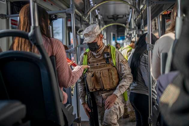 March 29, 2021, Santiago, Chile: A police officer verifies the health permits of the passengers on a public transport bus..Sanitary cords and police controls during the first day of total quarantine in the central area of the country, after the abrupt increase in Covid-19 cases in the Metropolitan region, the country s health authorities decreed a total quarantine for the central area of the country. Although Chile leads the number of vaccinated population, the increase in positive cases puts the stability of the health system at risk again. Santiago Chile - ZUMAs197 20210329_zaa_s197_150 Copyright: xFelipexFigueroax