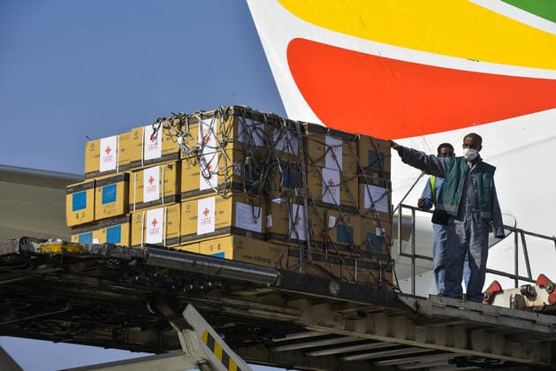 (210330) -- ADDIS ABABA, March 30, 2021 -- Workers unload China s Sinopharm COVID-19 vaccines, donated by the Chinese government to Ethiopia, at the Addis Ababa Bole International Airport in Addis Ababa, Ethiopia, on March 30, 2021. (Photo by Xinhua) ETHIOPIA-ADDIS ABABA-COVID-19-VACCINE-CHINA-DONATION MichaelxTewelde 