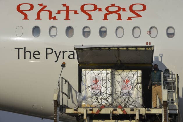 (210330) -- ADDIS ABABA, March 30, 2021 -- A batch of China s Sinopharm COVID-19 vaccines, donated by the Chinese government to Ethiopia, arrive at the Addis Ababa Bole International Airport in Addis Ababa, Ethiopia, on March 30, 2021. (Photo by Xinhua) ETHIOPIA-ADDIS ABABA-COVID-19-VACCINE-CHINA-DONATION MichaelxTewelde 