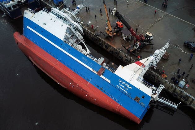 OTRADNOYE, LENINGRAD REGION, RUSSIA - MARCH 30, 2021: The heeled over Skorpion trawler is pictured at the Pella Shipyard. The vessel that is under construction, heeled over and the holds were flooded on March 30. Six workers were able to evacuate; a rescue operation for two people is underway. Peter Kovalev TASS  TS0FB01C