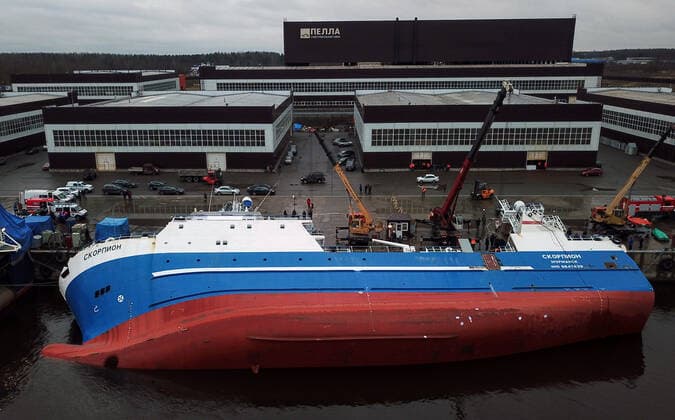 OTRADNOYE, LENINGRAD REGION, RUSSIA - MARCH 30, 2021: The heeled over Skorpion trawler is pictured at the Pella Shipyard. The vessel that is under construction, heeled over and the holds were flooded on March 30. Six workers were able to evacuate; a rescue operation for two people is underway. Peter Kovalev TASS  TS0FB01D